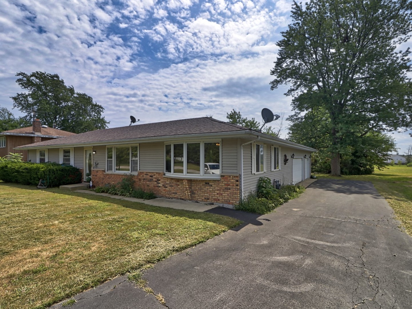 5159 West Margaret Street Monee, IL 60449 - Photo 2 of 13 a front view of a house with a garden and yard