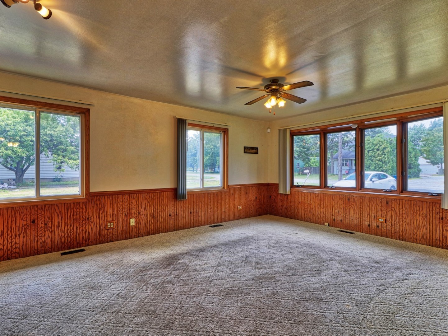 5159 West Margaret Street Monee, IL 60449 - Photo 5 of 13 an empty room with chandelier fan and windows
