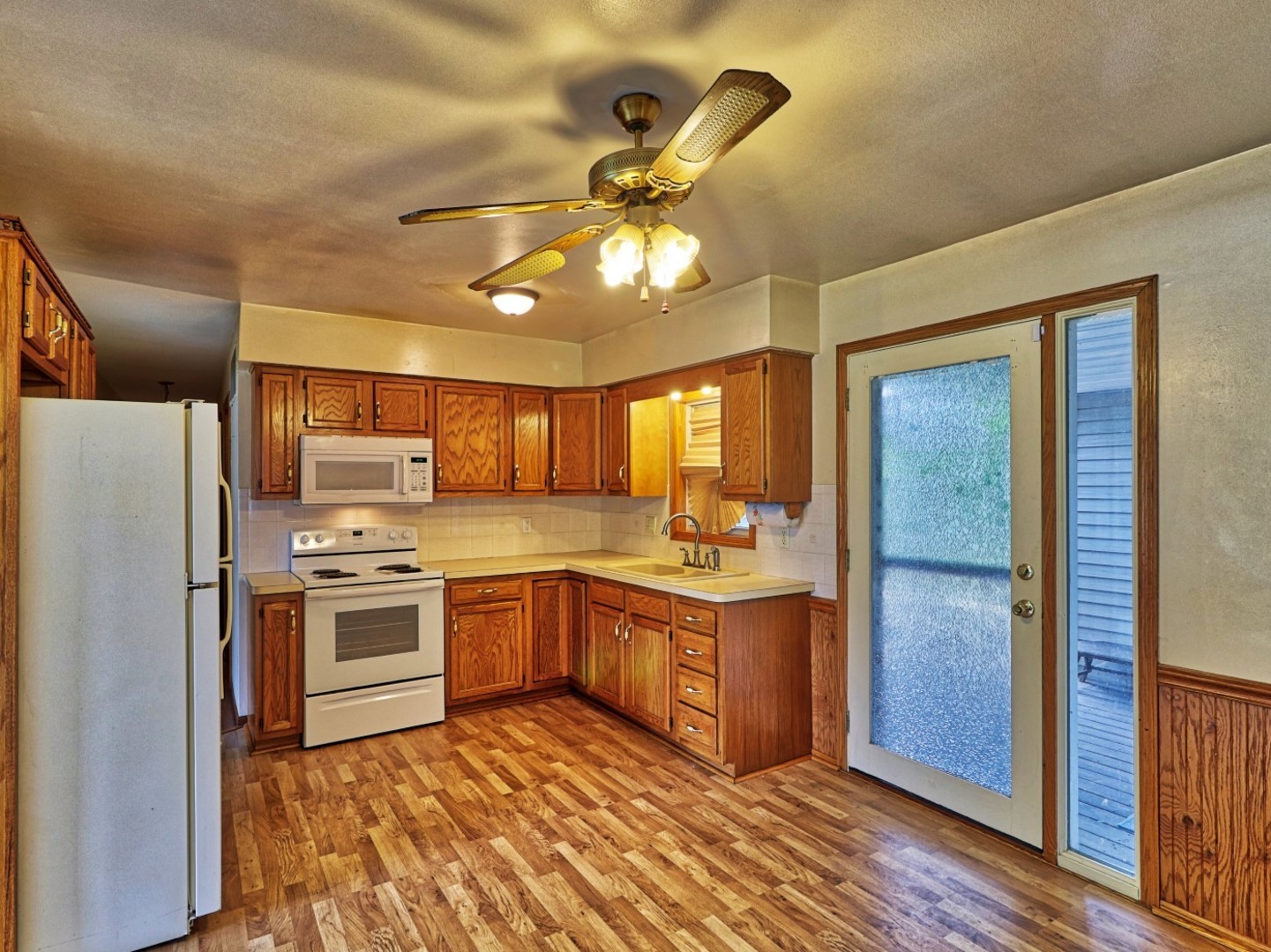 5159 West Margaret Street Monee, IL 60449 - Photo 6 of 13 a kitchen with cabinets a sink and stainless steel appliances