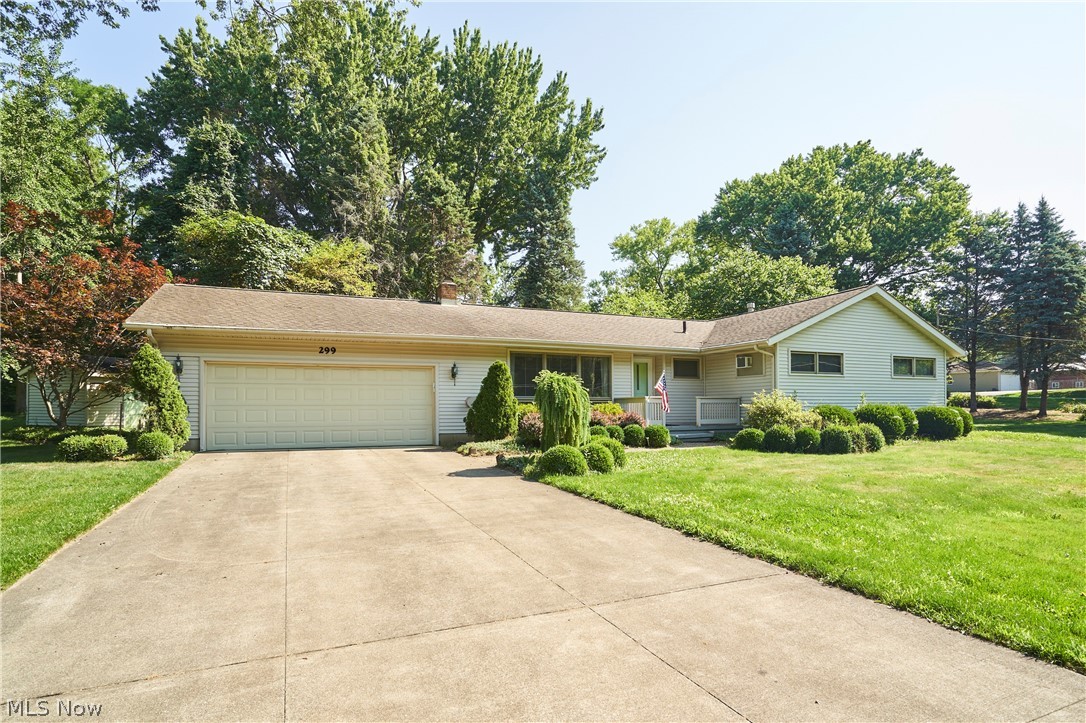 299 West Caston Road New Franklin, OH 44319 - Photo 22 of 23 Ranch-style residence featuring a wide concrete driveway, attached two-car garage, and a covered front entry