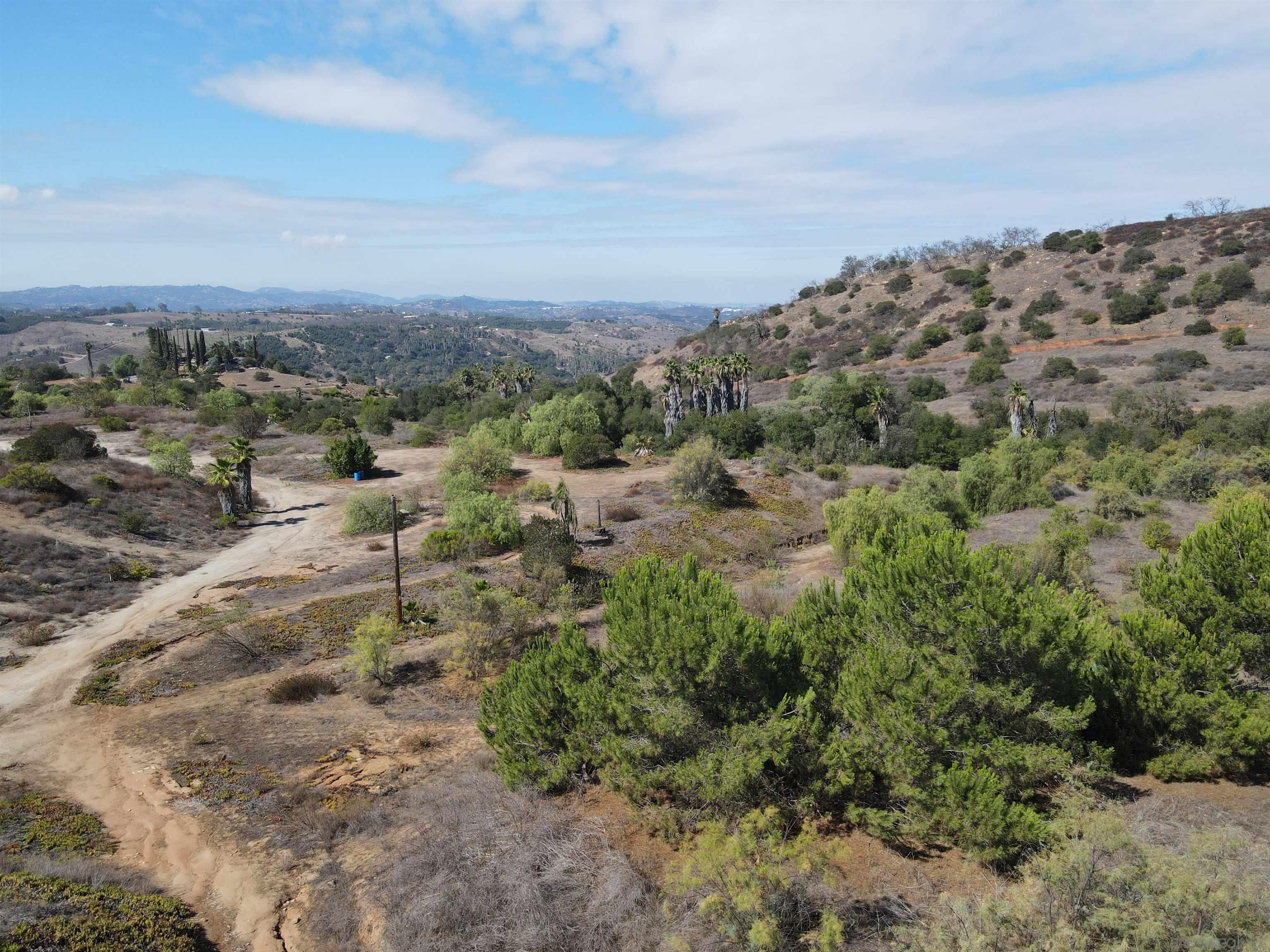 77 Jeffrey Heights Road Valley Center, CA 92082 - Photo 14 of 15 an aerial view of a house with a yard