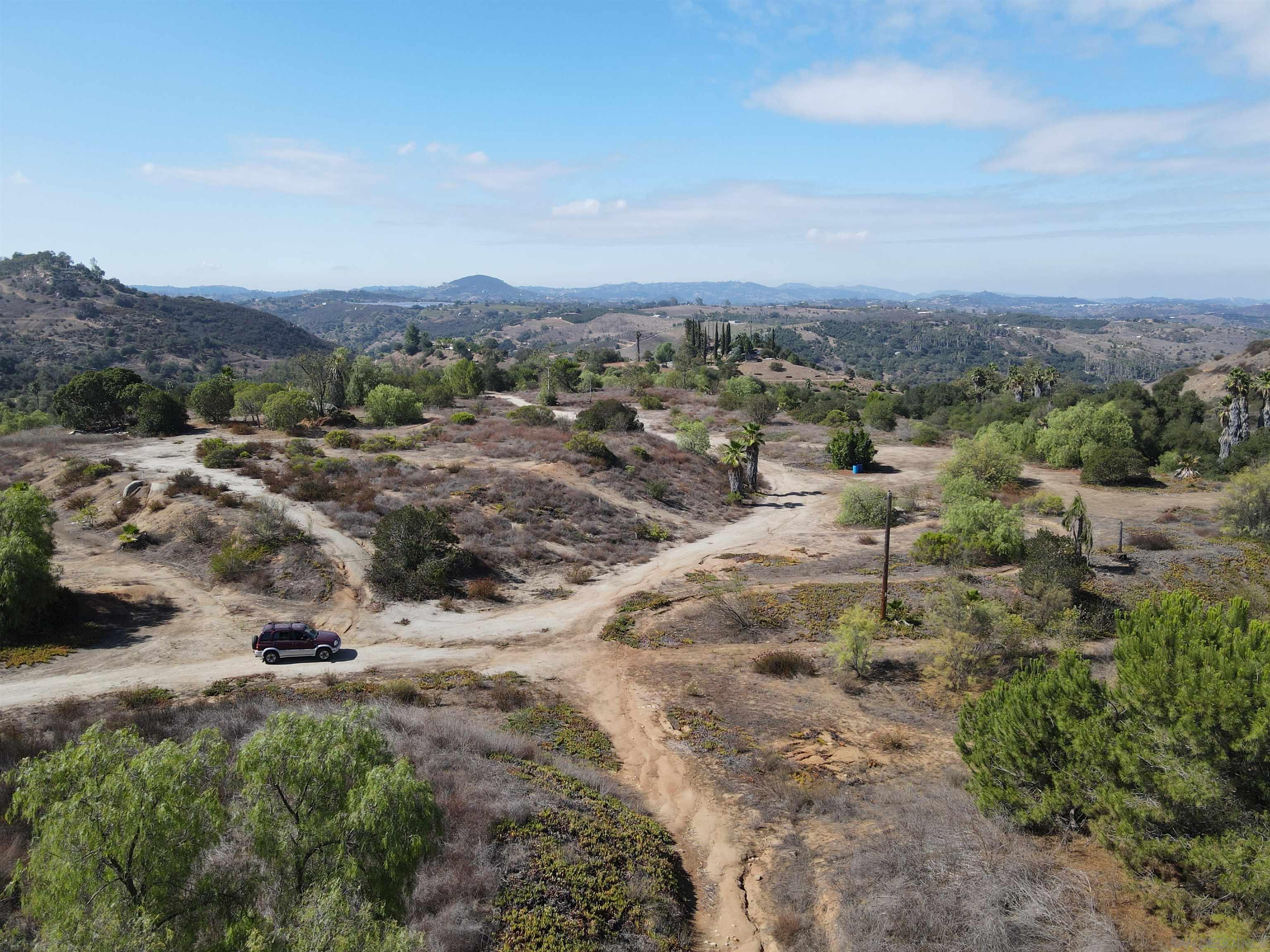 77 Jeffrey Heights Road Valley Center, CA 92082 - Photo 15 of 15 a view of a dry yard with trees