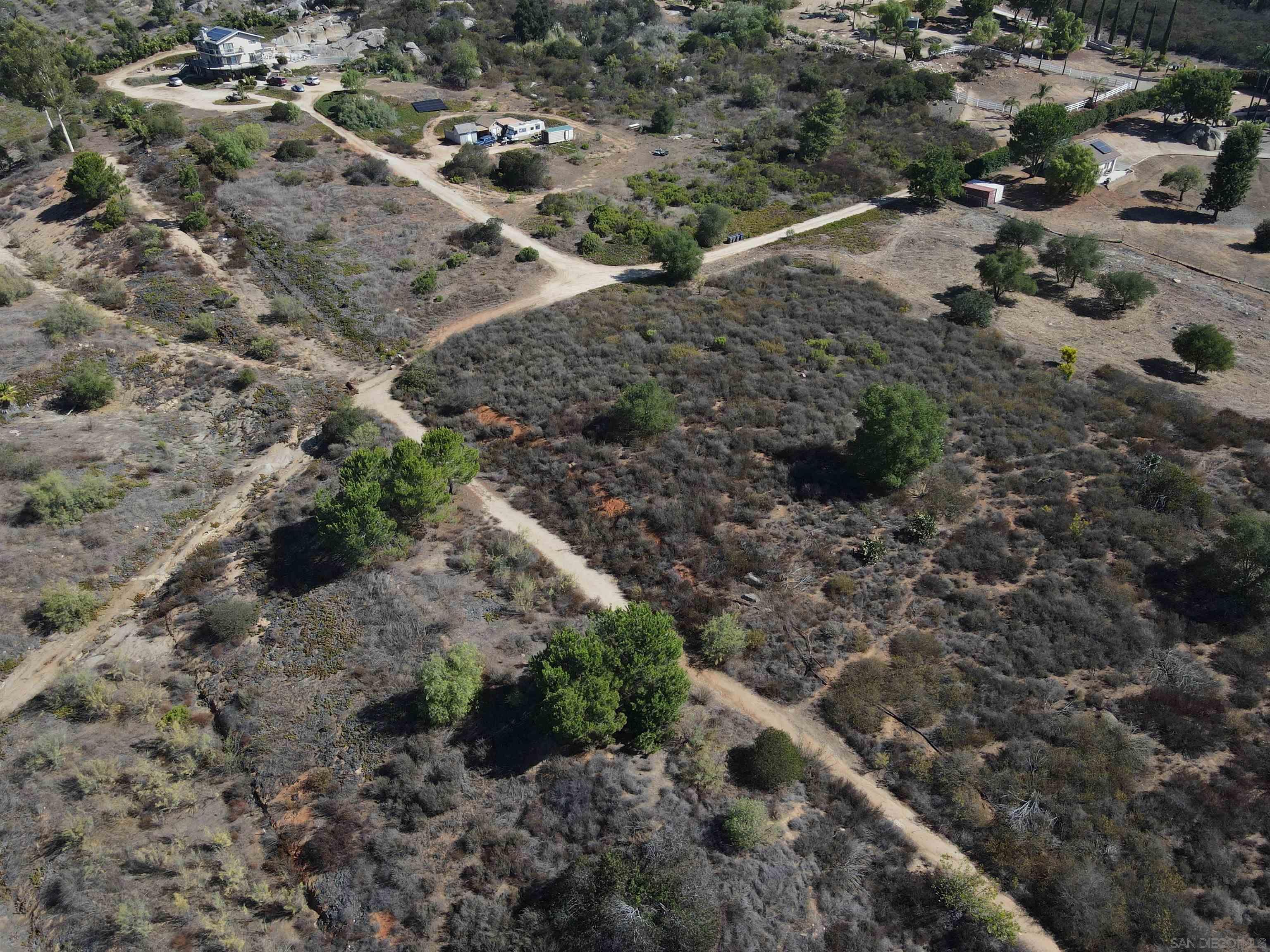 77 Jeffrey Heights Road Valley Center, CA 92082 - Photo 7 of 15 a view of a yard with lots of trees