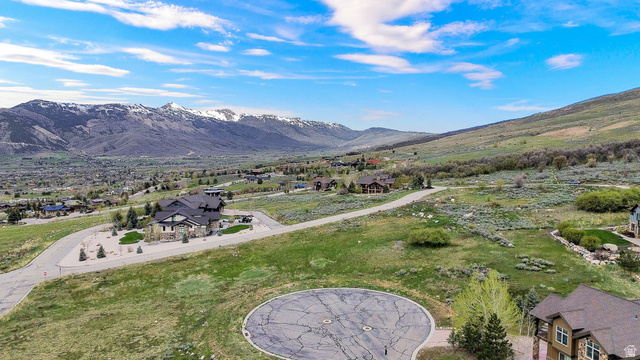 3722 Porcupine Ridge Drive, Unit 105 Eden, UT 84310 - Photo 12 of 22 Aerial perspective of suburban area featuring a mountain backdrop