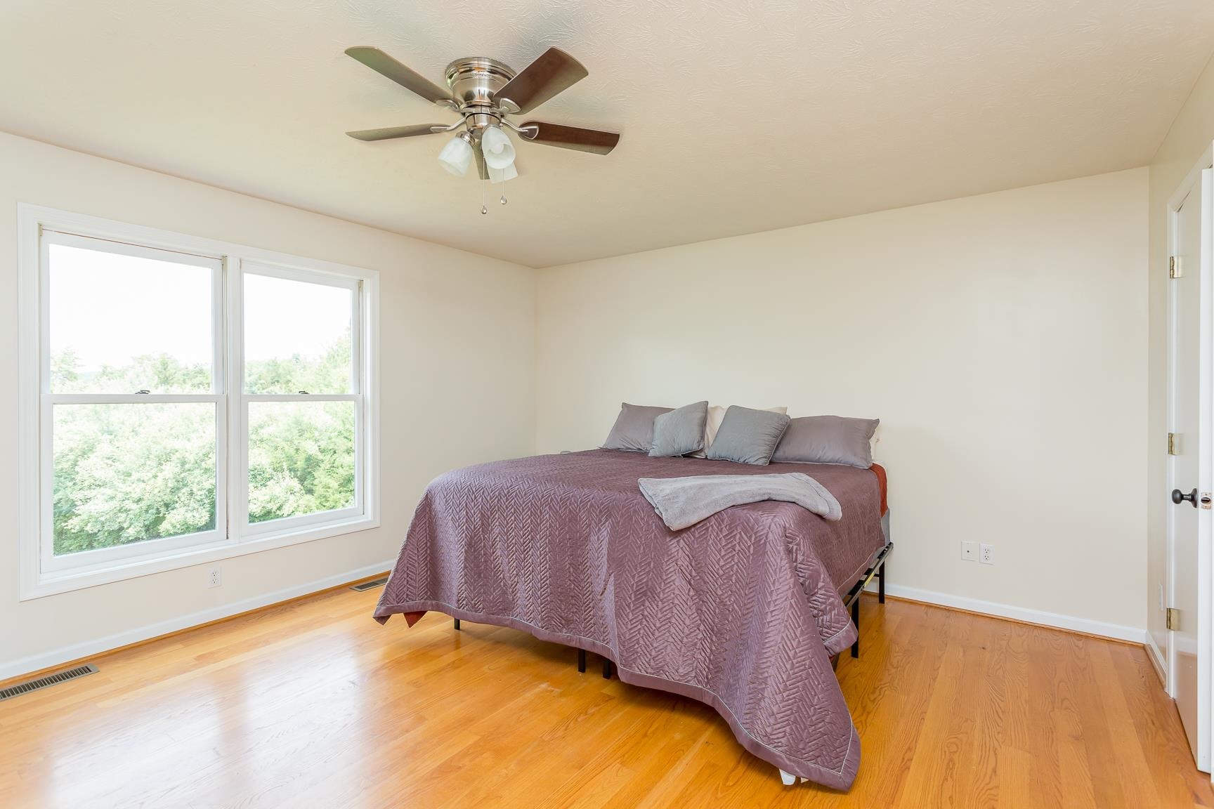 693 Stover Shop Road Churchville, VA 24421 - Photo 21 of 42 a bedroom with a bed and window