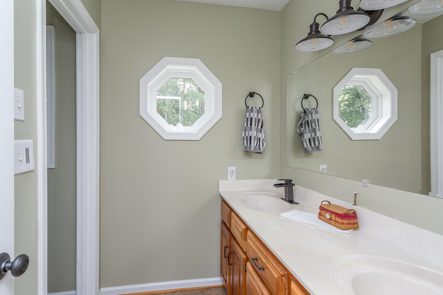 693 Stover Shop Road Churchville, VA 24421 - Photo 24 of 42 a bathroom with a sink and a mirror