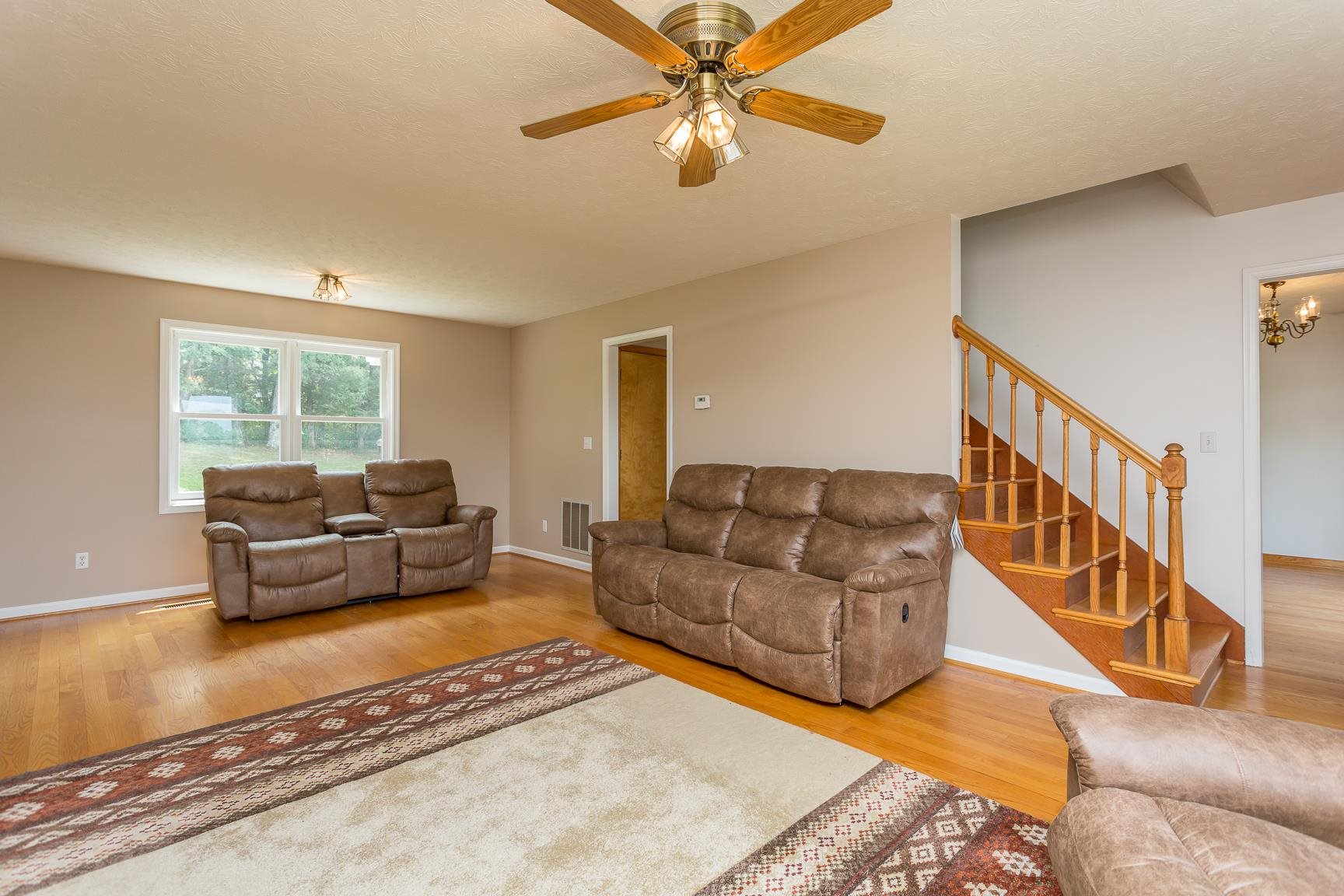 693 Stover Shop Road Churchville, VA 24421 - Photo 3 of 42 a living room with furniture and a rug
