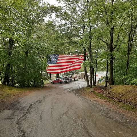 a backyard of a house with a table and chairs