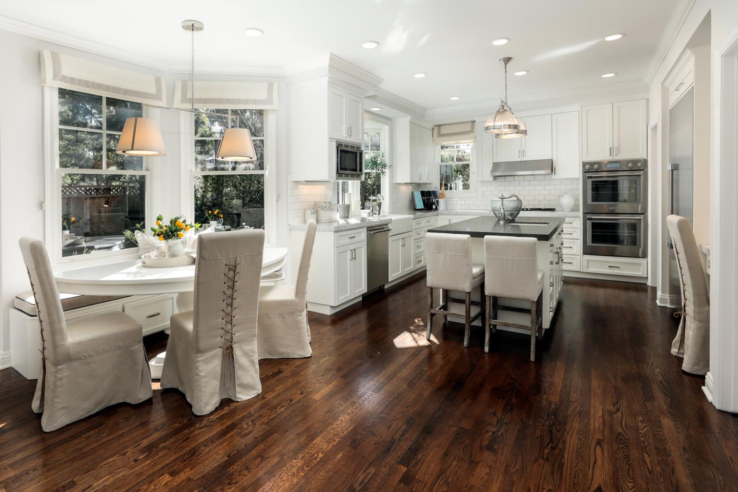 2 Brady Place Menlo Park, CA 94025 - Photo 12 of 39 a kitchen with stainless steel appliances kitchen island granite countertop a table chairs and a refrigerator