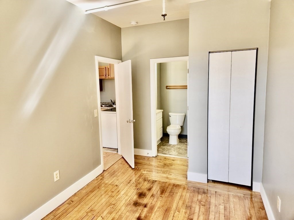 15 North Main Street, Unit 25 Attleboro, MA 02703 - Photo 3 of 4 a bathroom with a sink and a mirror