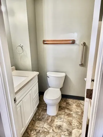 a bathroom with a toilet and a sink