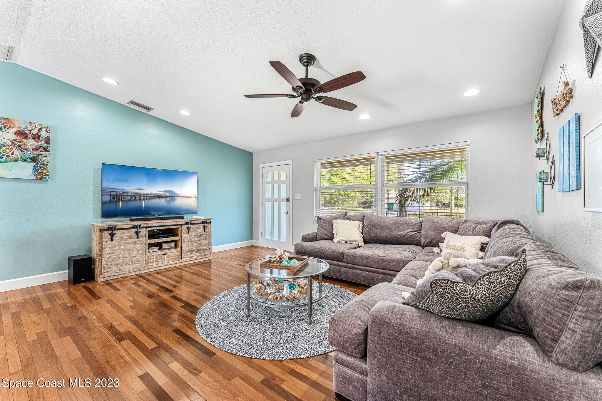 425 Cinnamon Drive Satellite Beach, FL 32937 - Photo 12 of 55 a living room with furniture and a flat screen tv