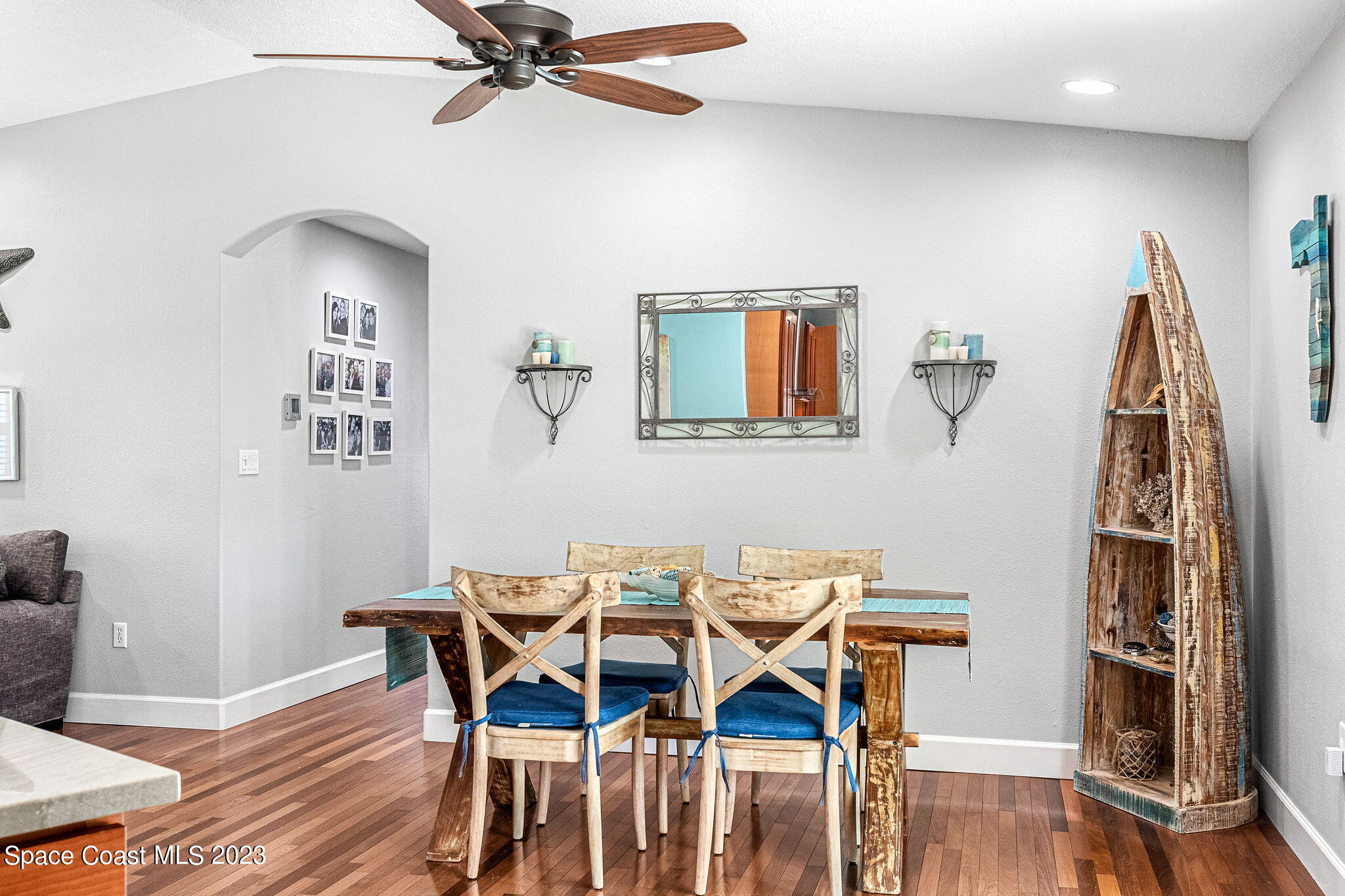 425 Cinnamon Drive Satellite Beach, FL 32937 - Photo 16 of 55 a view of a dining room with furniture and wooden floor