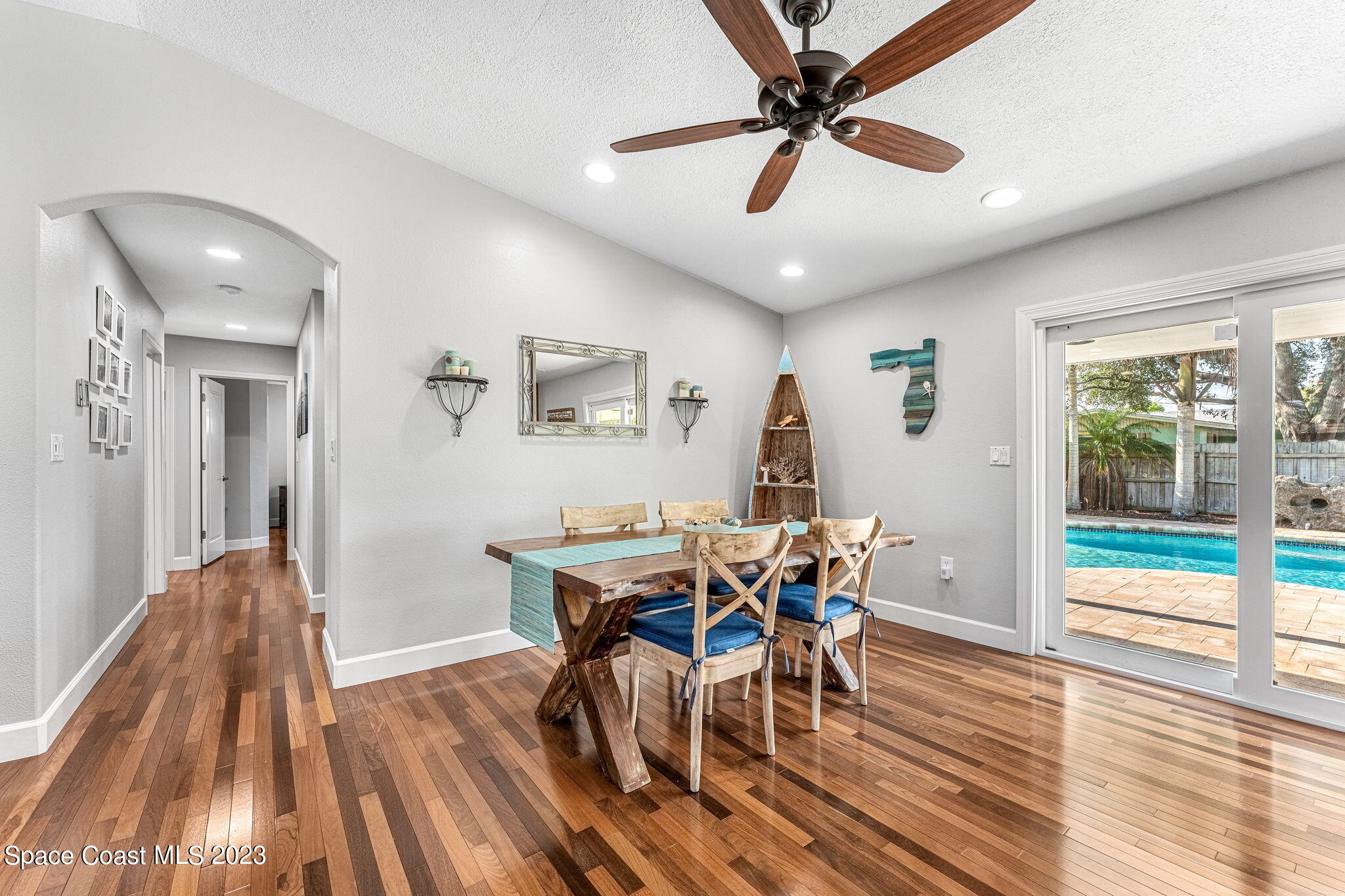 425 Cinnamon Drive Satellite Beach, FL 32937 - Photo 17 of 55 a view of a dining room with furniture window and wooden floor