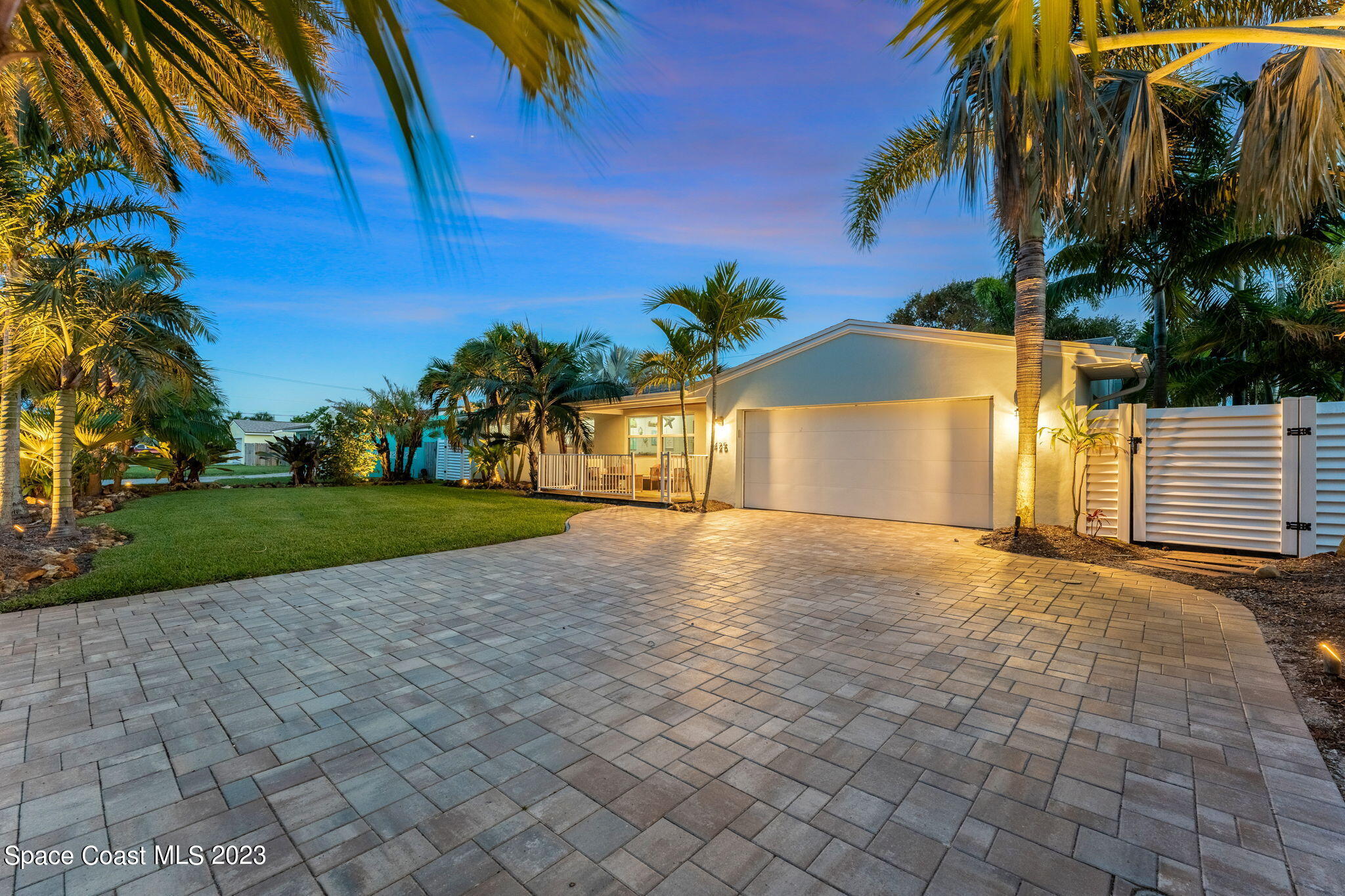 425 Cinnamon Drive Satellite Beach, FL 32937 - Photo 3 of 55 a view of a house with a yard and potted plants