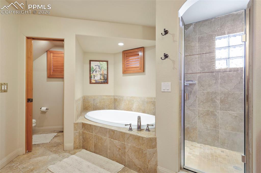 21 Crystal Park Road Manitou Springs, CO 80829 - Photo 12 of 27 Primary suite with attached 5 piece bathroom, walk-in closet.