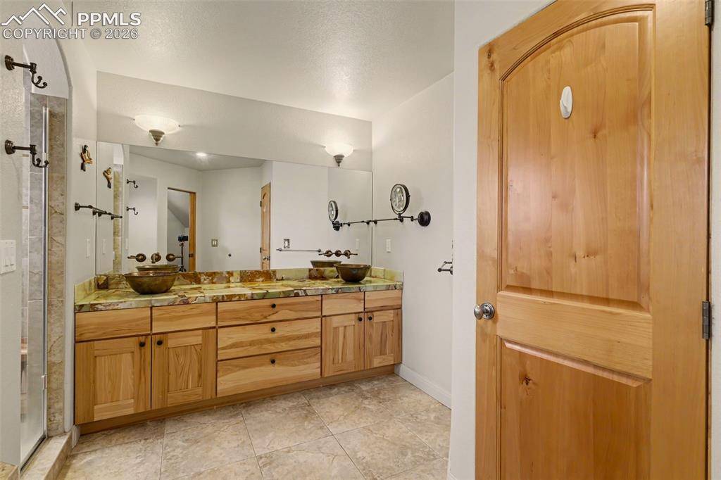 21 Crystal Park Road Manitou Springs, CO 80829 - Photo 14 of 27 Primary suite with attached 5 piece bathroom, walk-in closet.