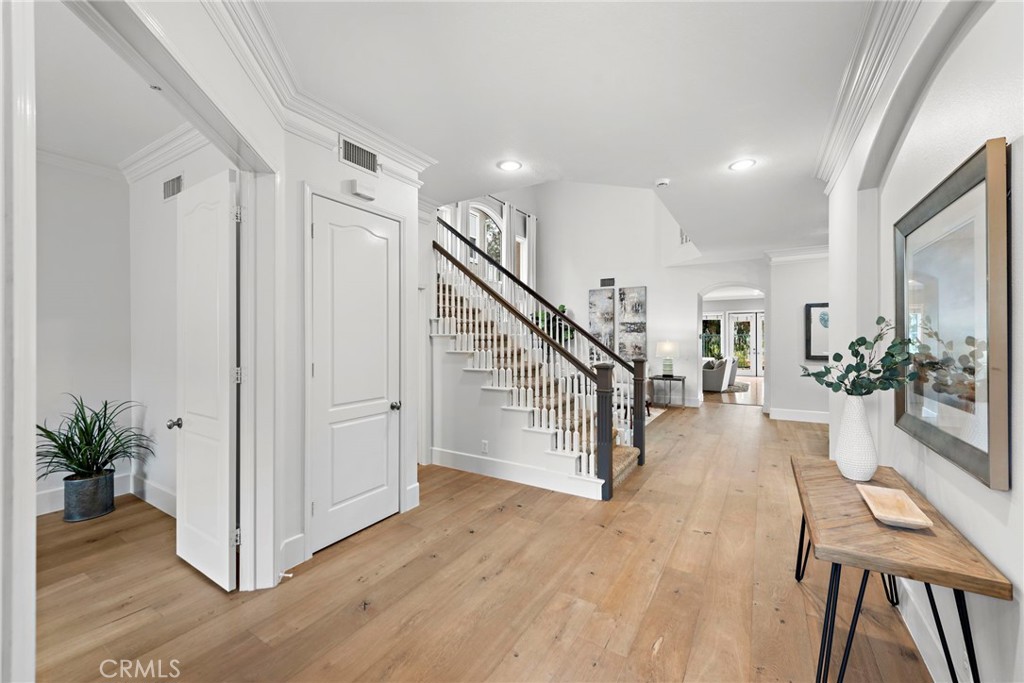 Gorgeous hardwood plank flooring accents the front entry.