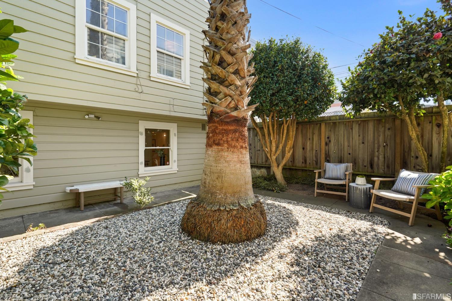 2290 Alemany Boulevard San Francisco, CA 94112 - Photo 2 of 45 a view of a patio with table and chairs with wooden fence and plants
