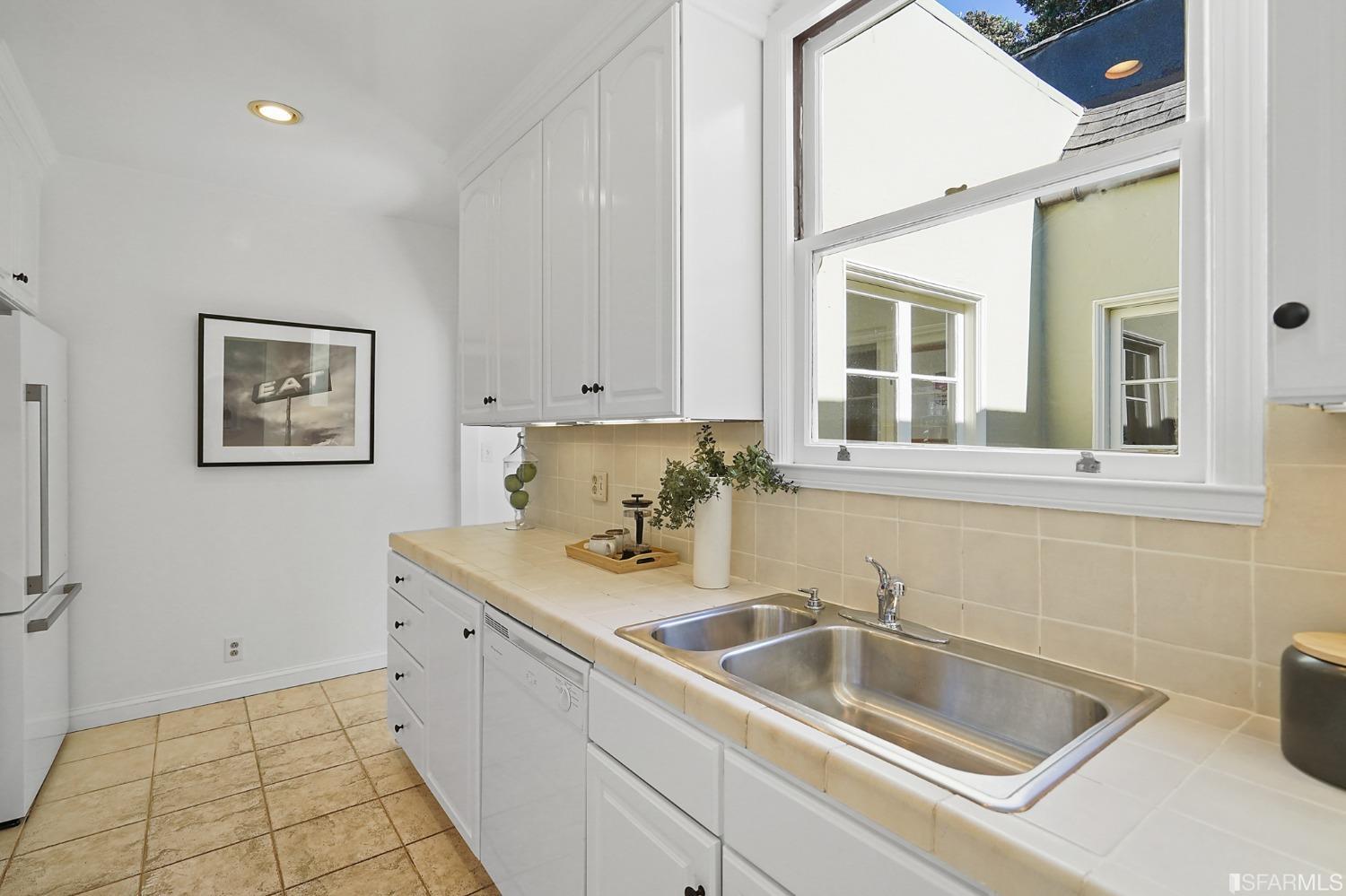 2290 Alemany Boulevard San Francisco, CA 94112 - Photo 25 of 45 a kitchen with a sink and cabinets