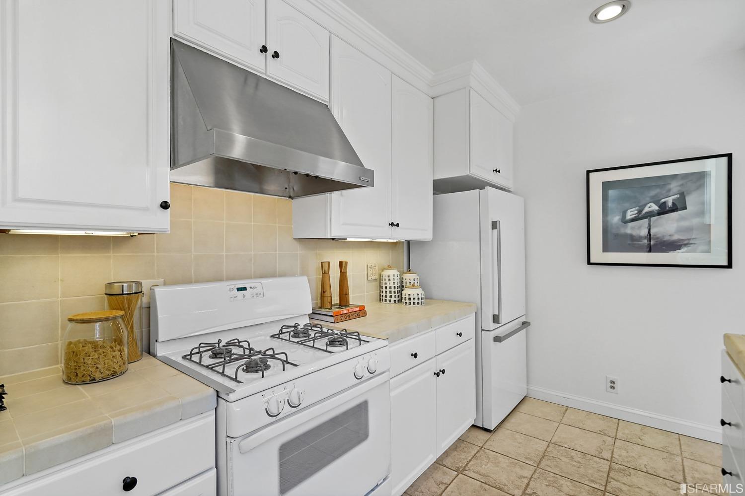 2290 Alemany Boulevard San Francisco, CA 94112 - Photo 26 of 45 a kitchen with a stove and a refrigerator