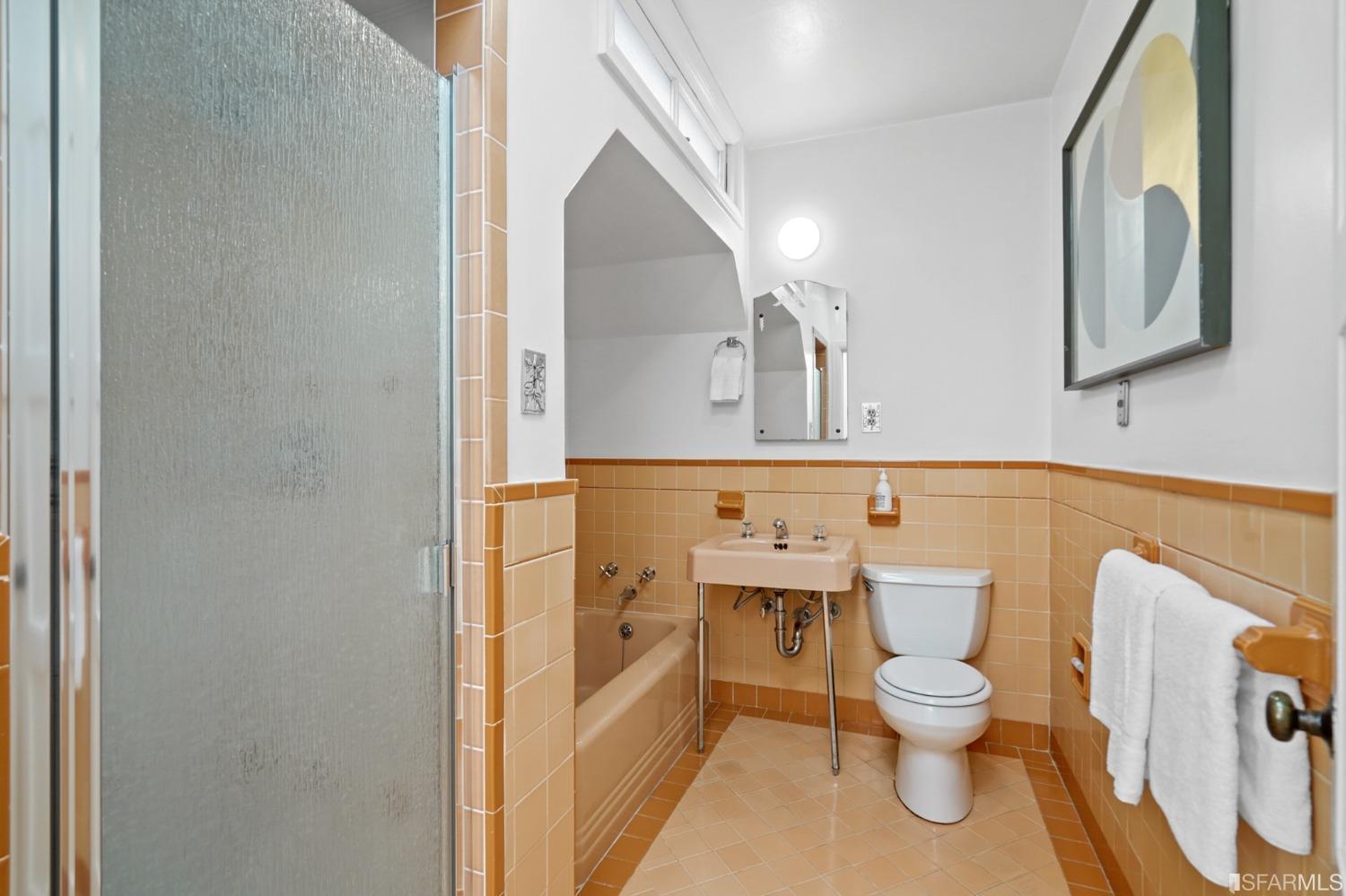 2290 Alemany Boulevard San Francisco, CA 94112 - Photo 28 of 45 a bathroom with a toilet sink and mirror