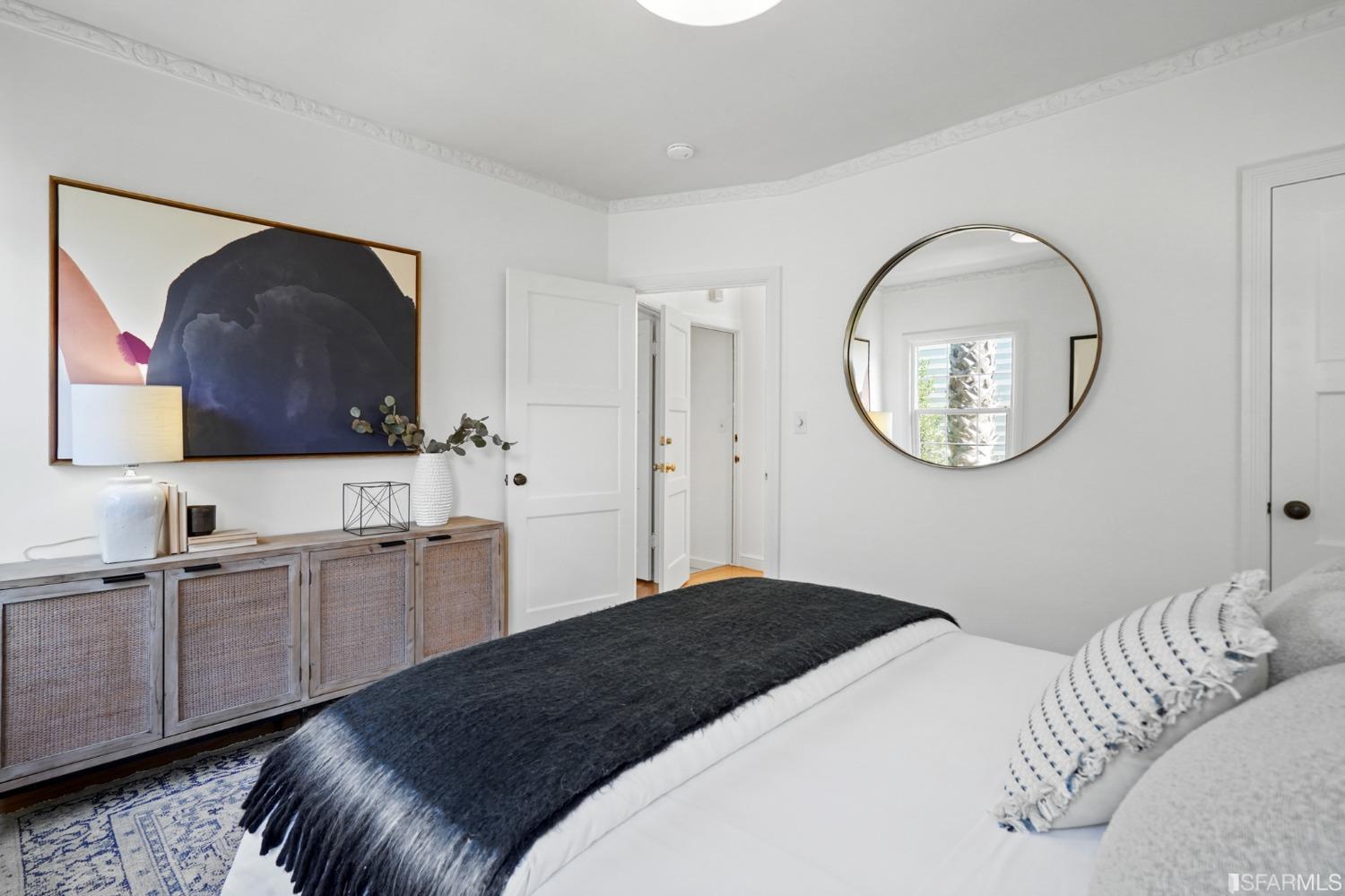 2290 Alemany Boulevard San Francisco, CA 94112 - Photo 31 of 45 a bedroom with a bed and a flat screen tv