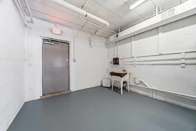 a bathroom with a sink mirror and toilet