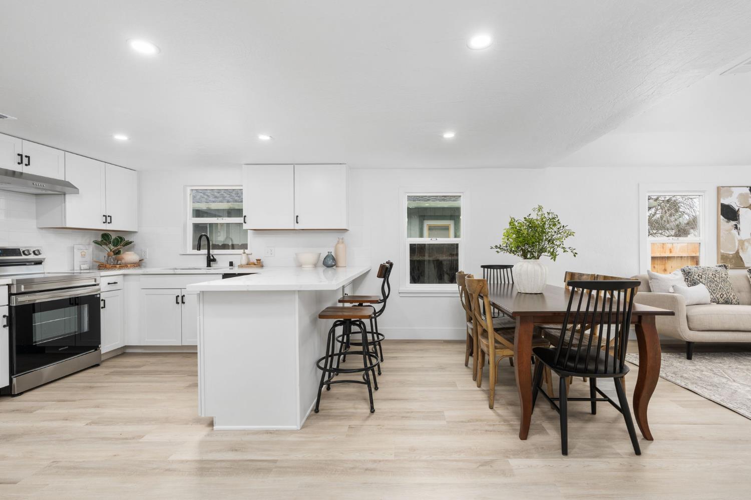 1366 East Alexander Avenue Merced, CA 95340 - Photo 13 of 30 a kitchen with a table and chairs in it