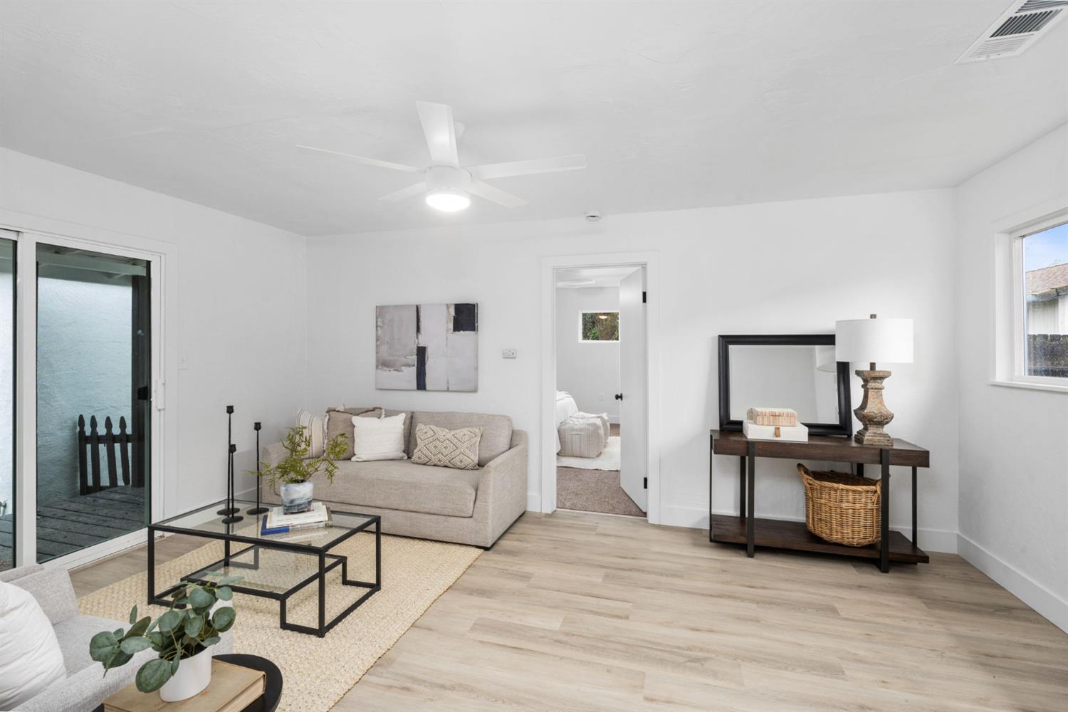 1366 East Alexander Avenue Merced, CA 95340 - Photo 17 of 30 a living room with furniture and kitchen view