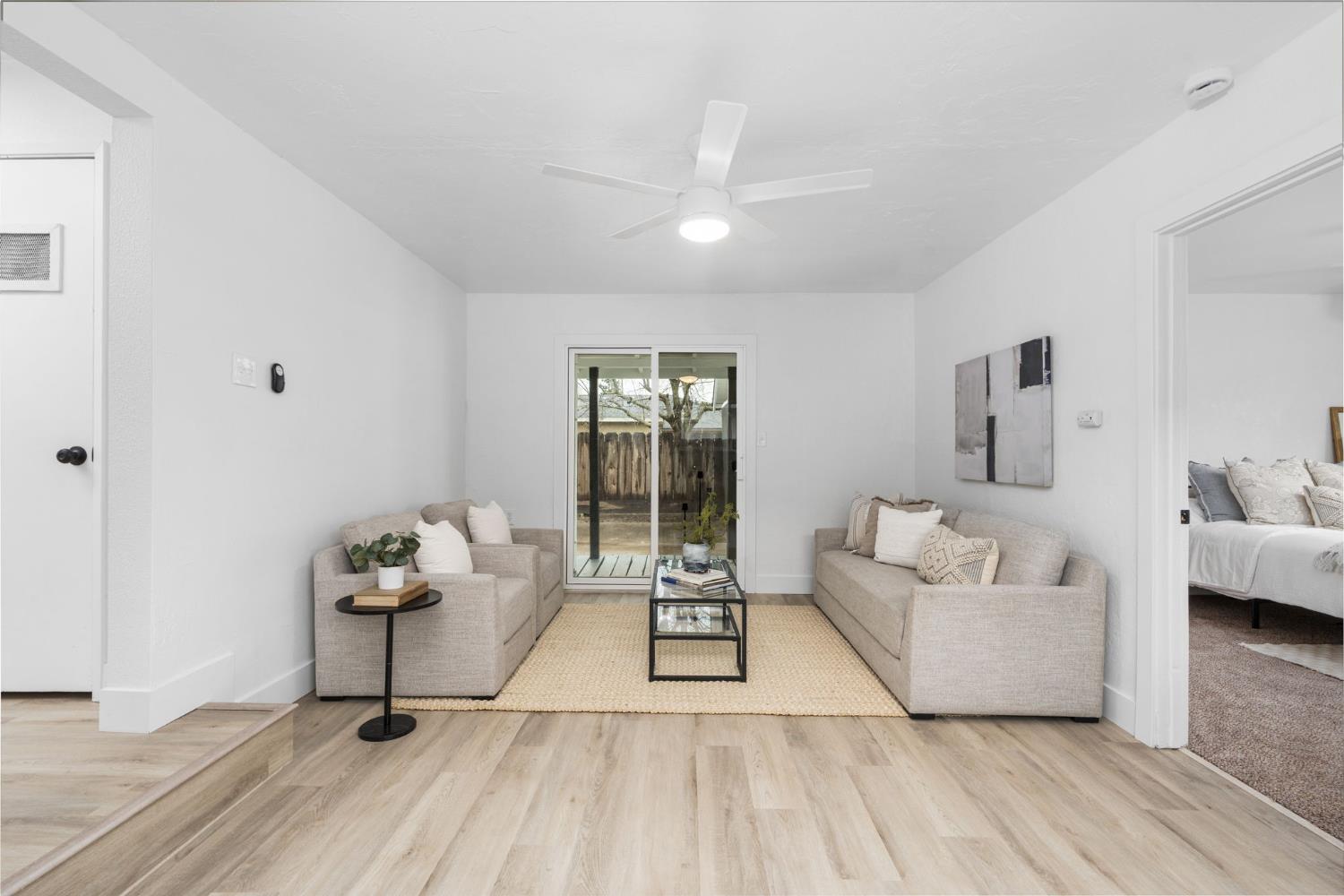 1366 East Alexander Avenue Merced, CA 95340 - Photo 18 of 30 a living room with furniture and a potted plant