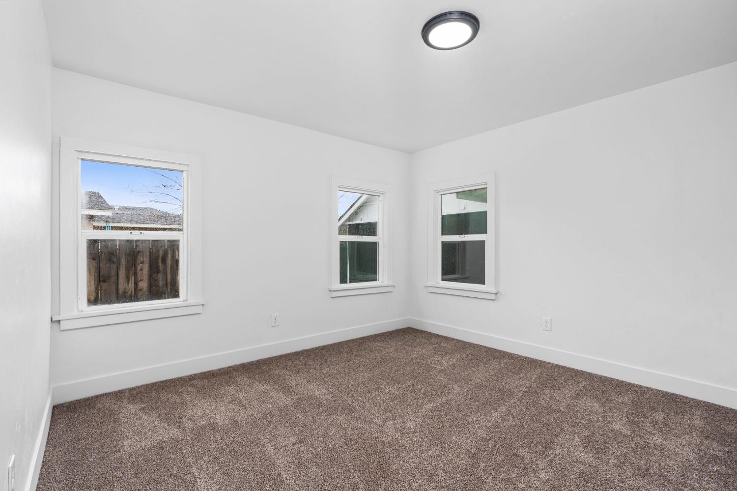 1366 East Alexander Avenue Merced, CA 95340 - Photo 22 of 30 an empty room with windows
