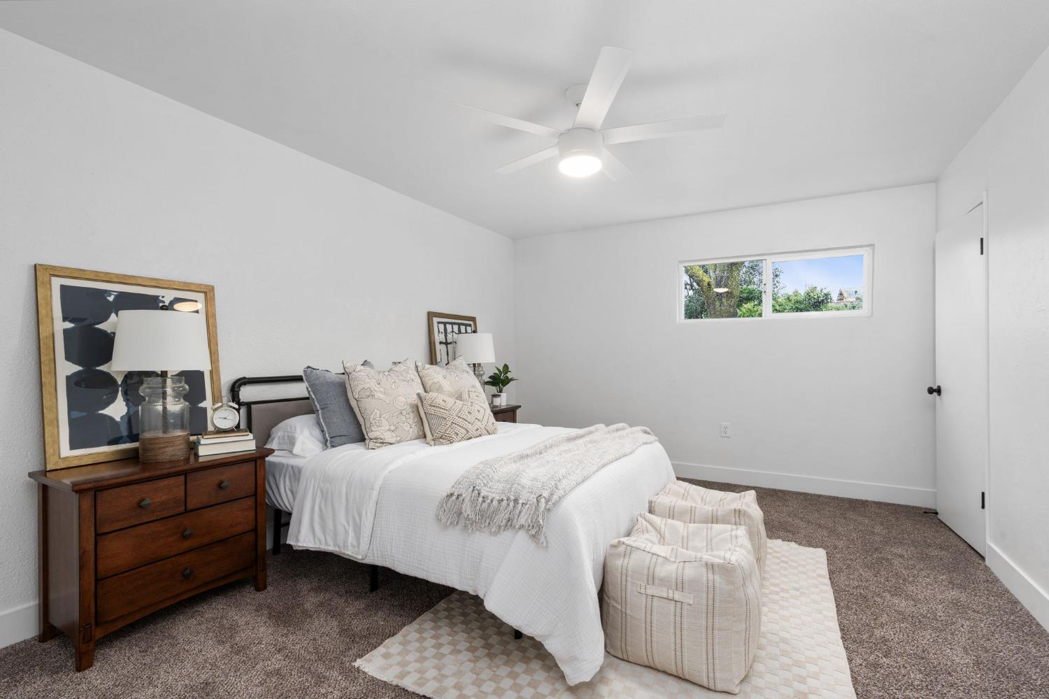 1366 East Alexander Avenue Merced, CA 95340 - Photo 23 of 30 a bedroom with a bed and wooden floor