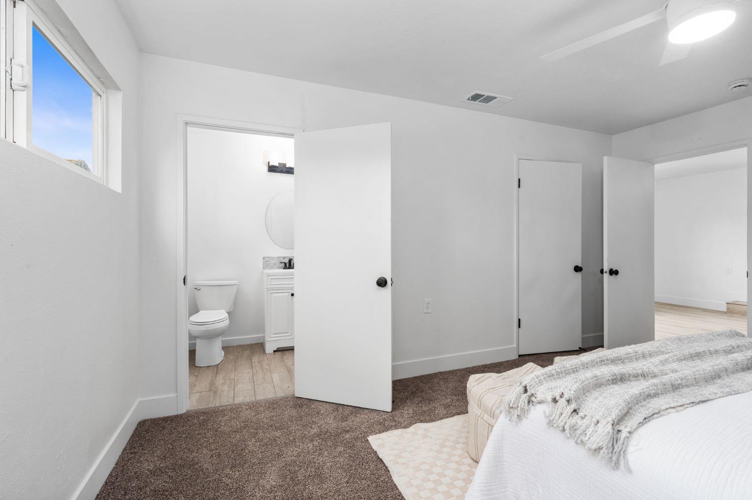 1366 East Alexander Avenue Merced, CA 95340 - Photo 24 of 30 a spacious bedroom with a bed and a table