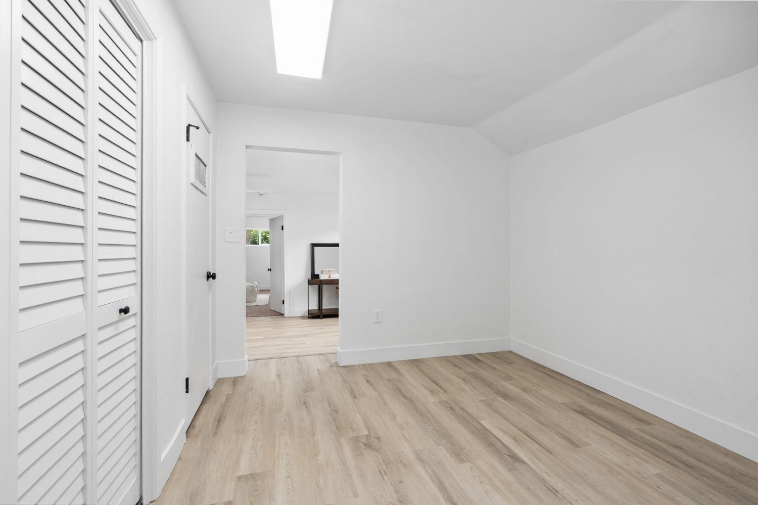 1366 East Alexander Avenue Merced, CA 95340 - Photo 26 of 30 a view of a room with wooden floor and white walls