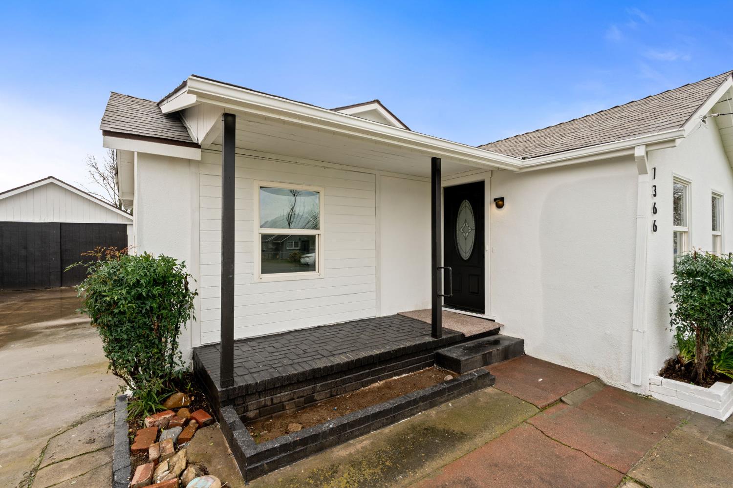 1366 East Alexander Avenue Merced, CA 95340 - Photo 4 of 30 a front view of house with a garden