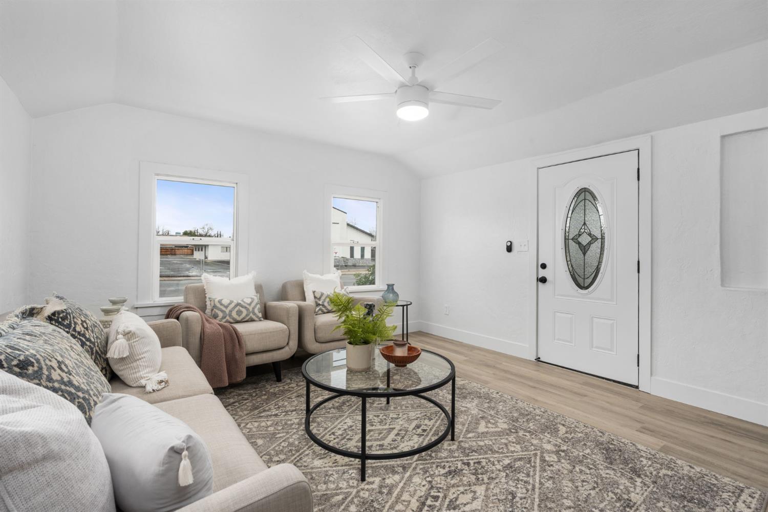 1366 East Alexander Avenue Merced, CA 95340 - Photo 7 of 30 a living room with furniture a rug and white walls