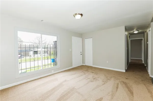 a view of an empty room with a window