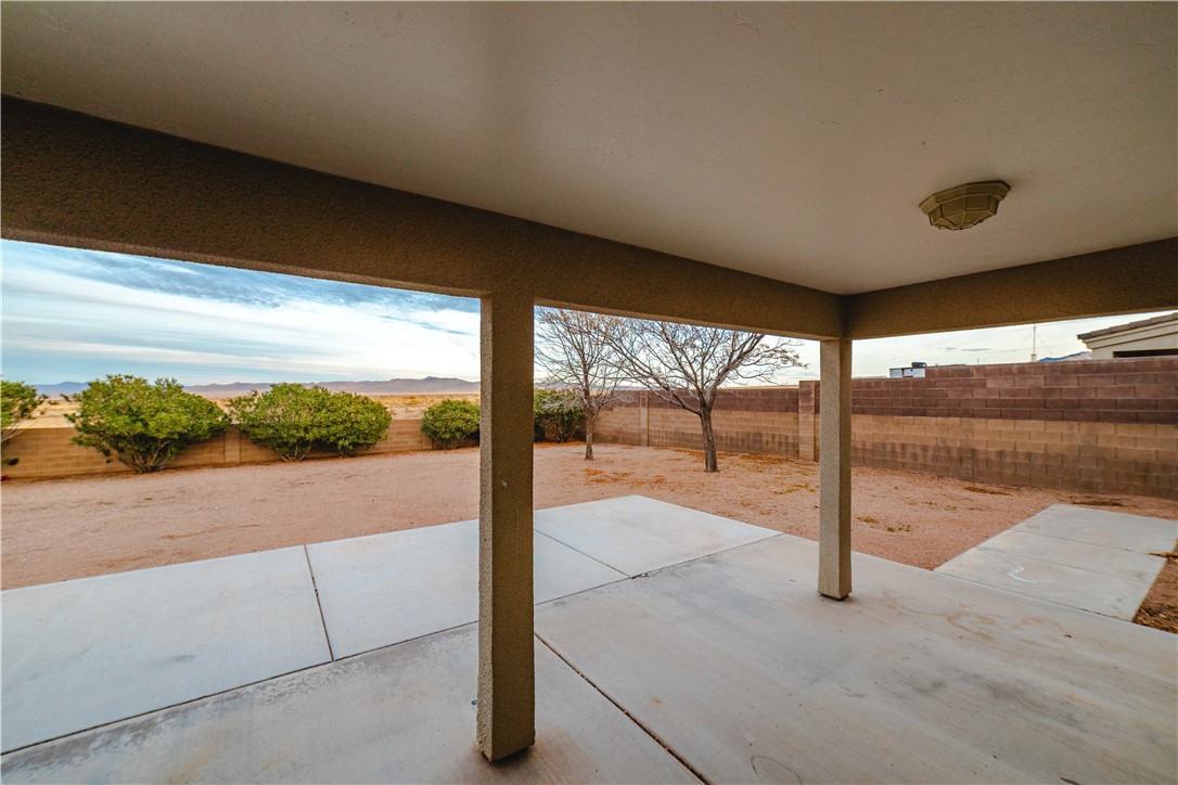 3374 Roma Road Kingman, AZ 86401 - Photo 60 of 64 Fenced backyard with a patio