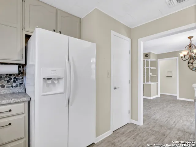 a white refrigerator freezer sitting in a kitchen