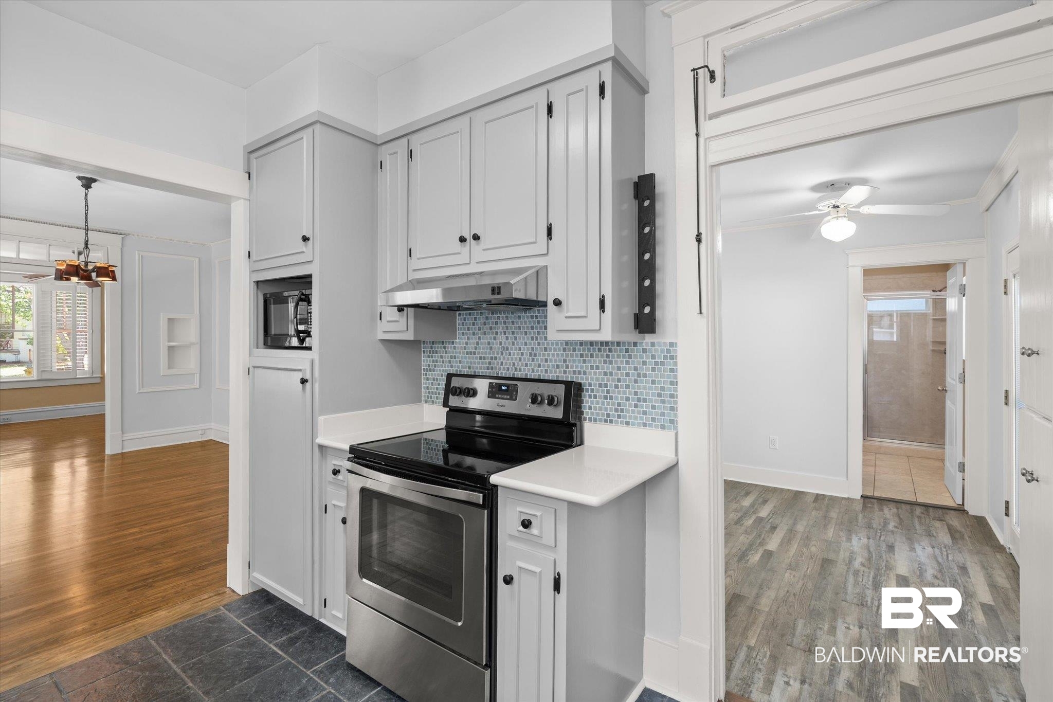 24 Macy Place Mobile, AL 36604 - Photo 15 of 38 Kitchen featuring stainless steel electric range oven, under cabinet range hood, light countertops, a chandelier, and a ceiling fan