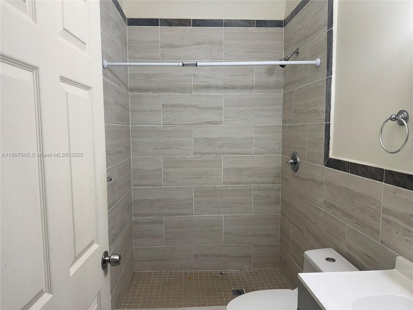 12800 Southwest 222nd Street Miami, FL 33170 - Photo 16 of 19 a bathroom with a shower and toilet