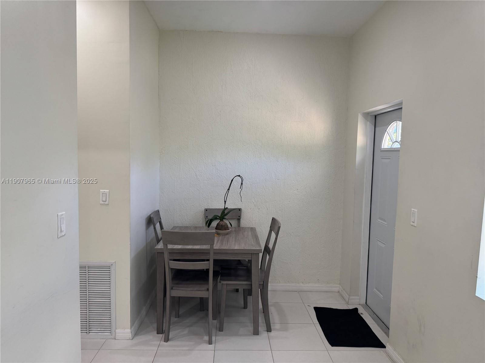 12800 Southwest 222nd Street Miami, FL 33170 - Photo 17 of 19 a dining room with furniture and a potted plant