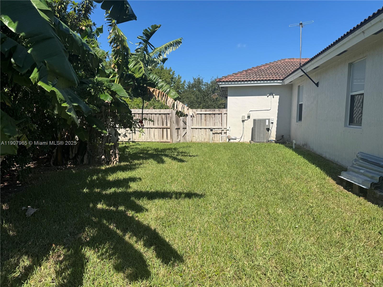 12800 Southwest 222nd Street Miami, FL 33170 - Photo 6 of 19 a view of a house with a backyard