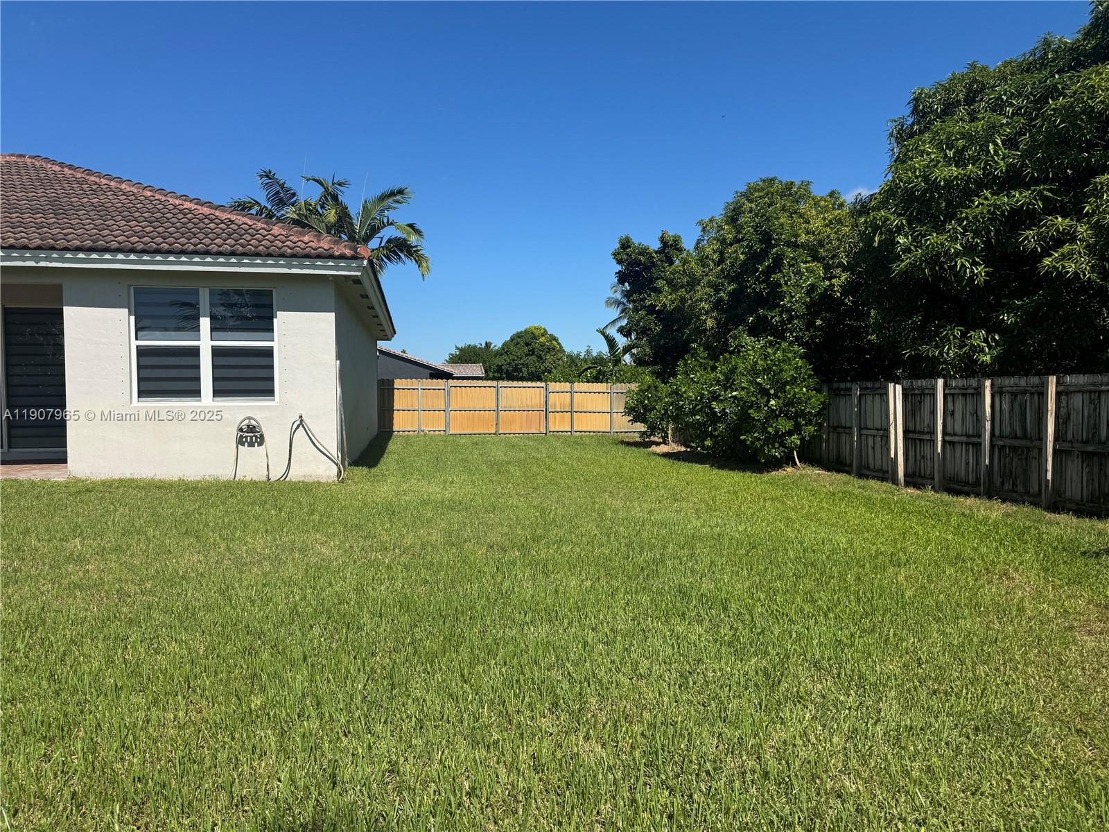 12800 Southwest 222nd Street Miami, FL 33170 - Photo 7 of 19 a view of a house with a yard