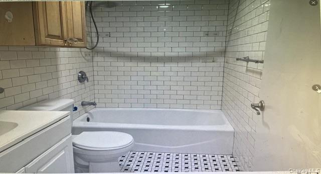 45 James Street Inwood, NY 11096 - Photo 11 of 11 a bathroom with a toilet a sink and bathtub