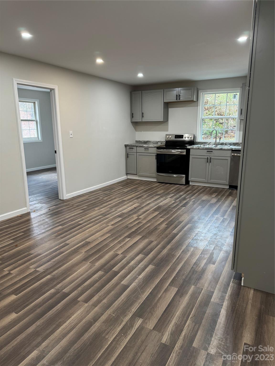 285 Arrowood Road Salisbury, NC 28144 - Photo 2 of 15 a kitchen with granite countertop stainless steel appliances and wooden cabinets