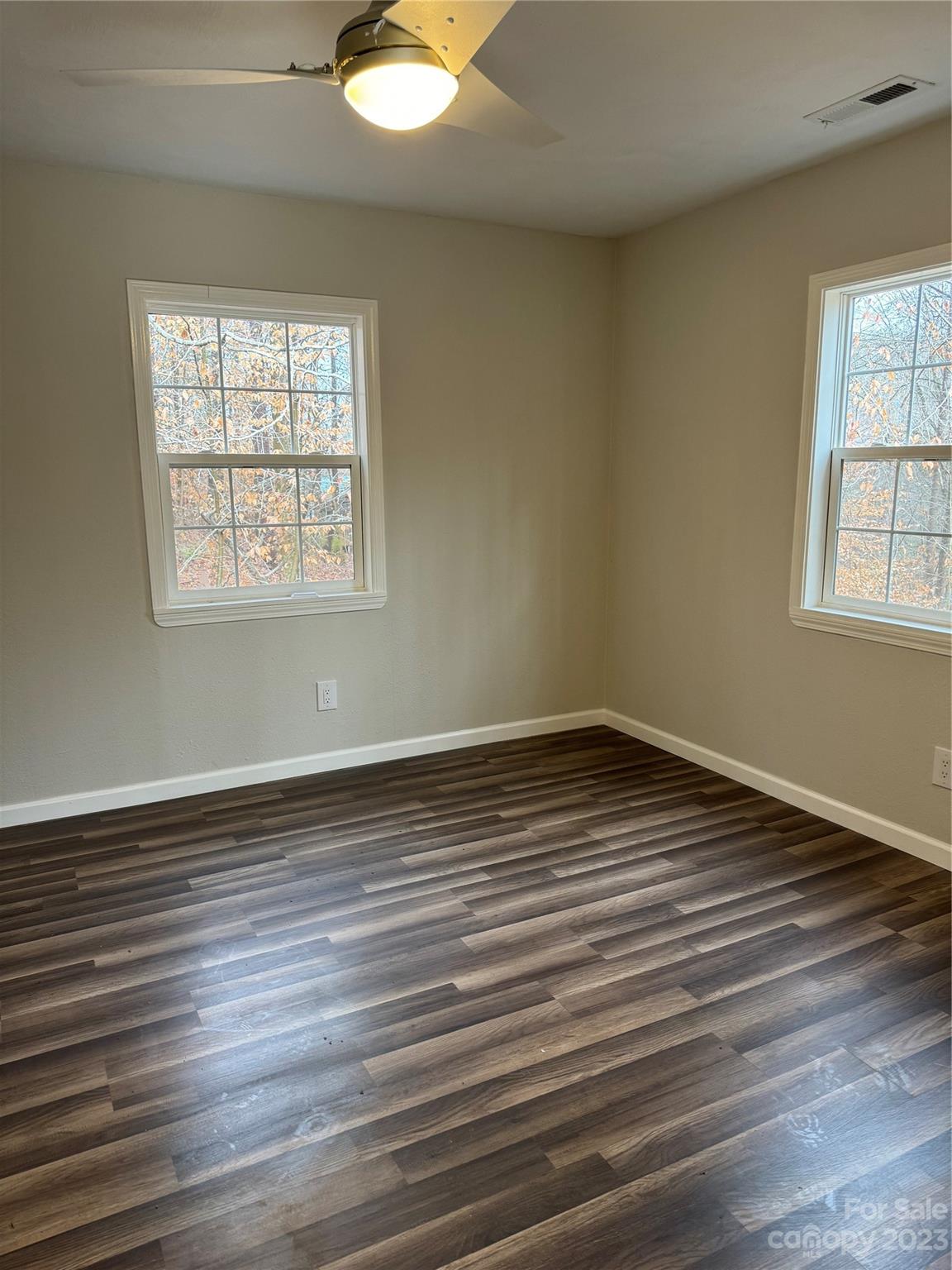 285 Arrowood Road Salisbury, NC 28144 - Photo 5 of 15 an empty room with wooden floor and windows