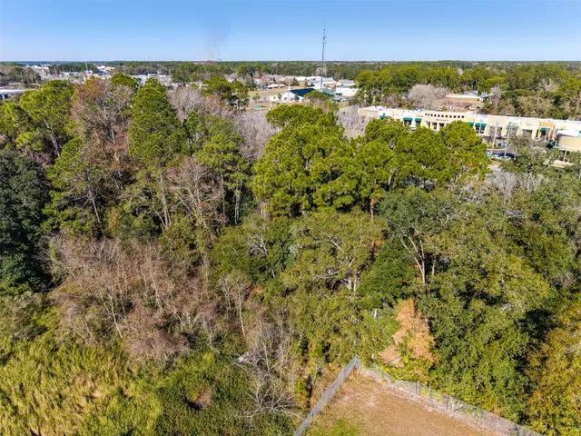 an aerial view of residential building and lake