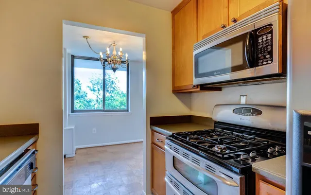 a kitchen with a stove and a microwave
